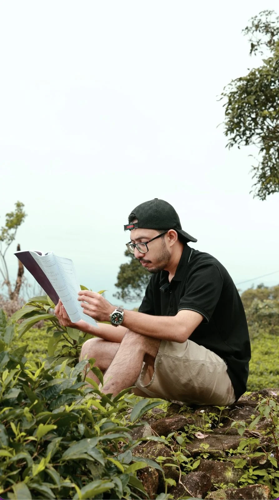 A NeoSkill student reading his printed study material outdoors